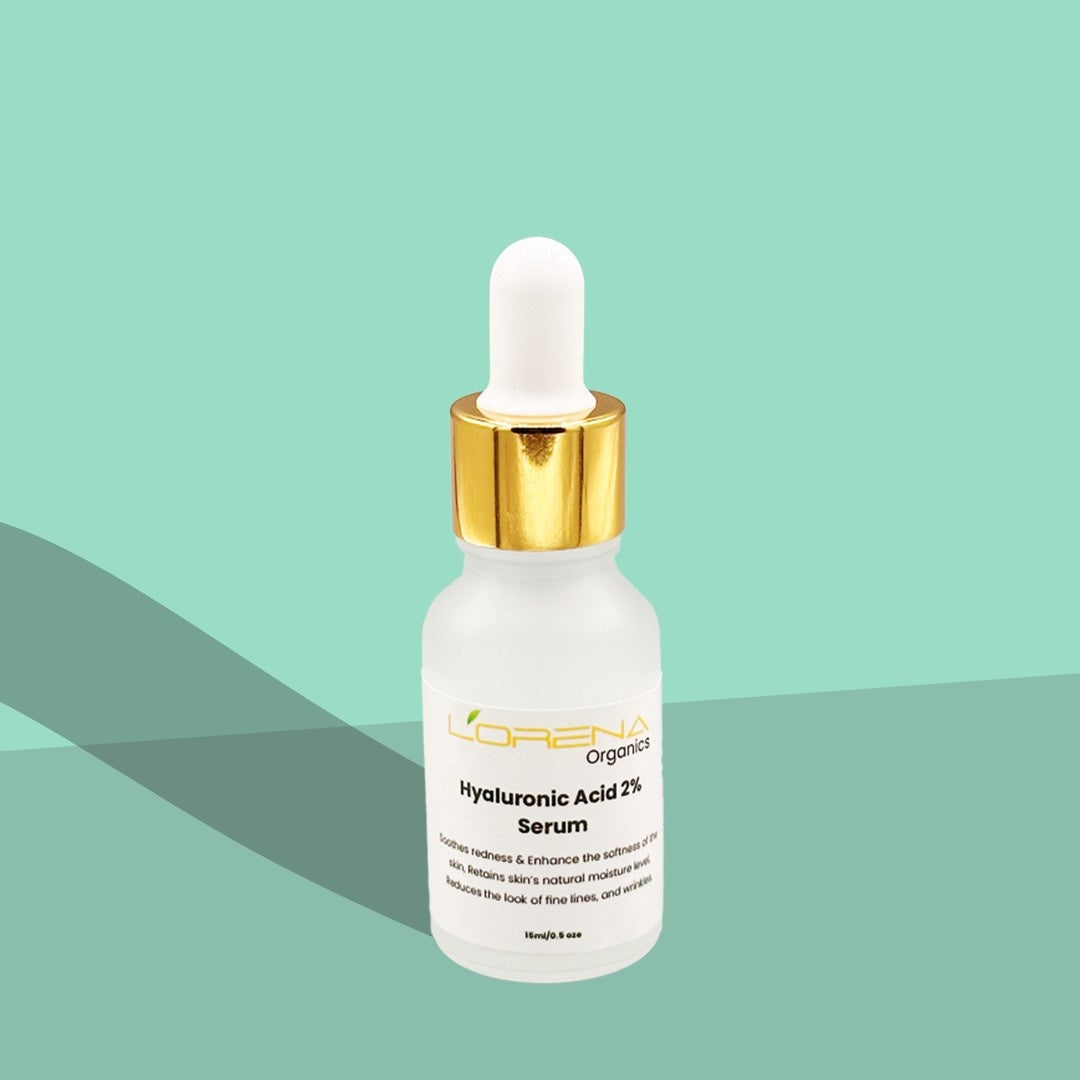 Skincare serum bottle with dropper on a green background
